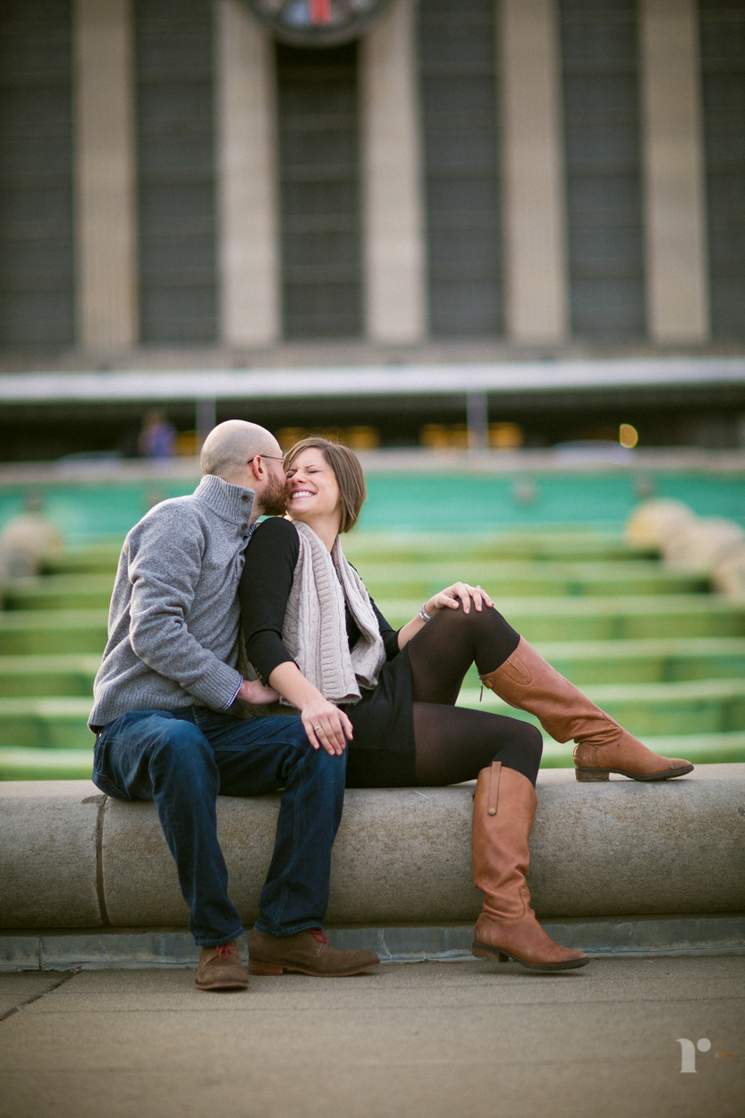 engaged couple laughing in front of cincinnati museum center